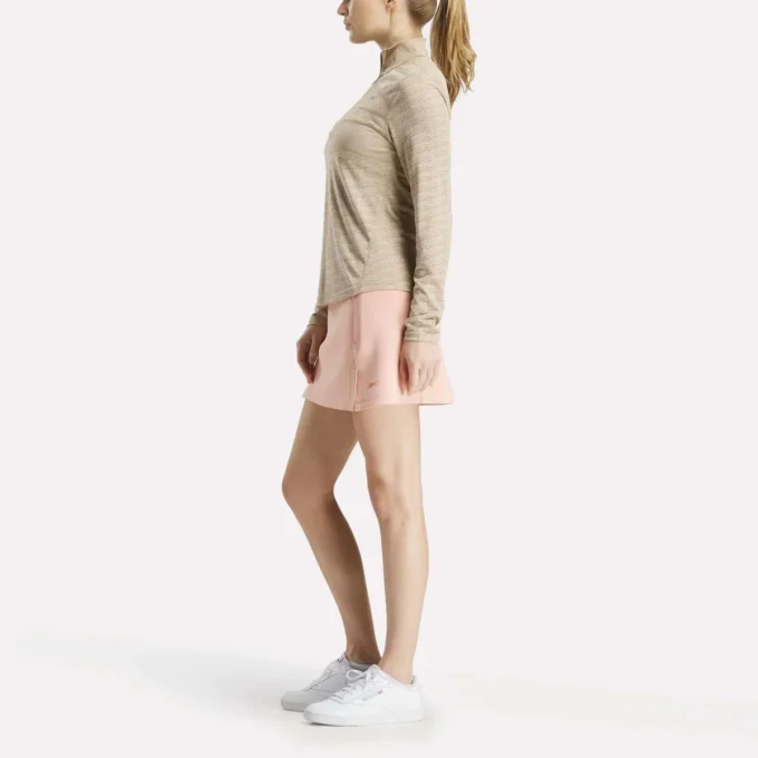 Damska bluza golfowa z długim rękawem, zaprojektowana z wykorzystaniem technologii Vector Jacquard, z zamkiem 1/4 Damska bluza golfowa z długim rękawem, zaprojektowana z wykorzystaniem technologii Vector Jacquard, z zamkiem 1/4