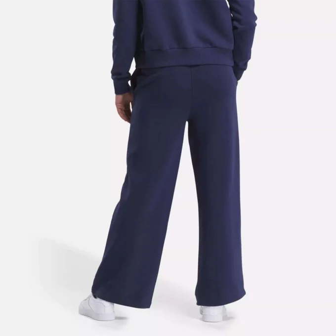 Damskie spodnie z szerokimi nogawkami i małym logo Reebok Identity Damskie spodnie z szerokimi nogawkami i małym logo Reebok Identity